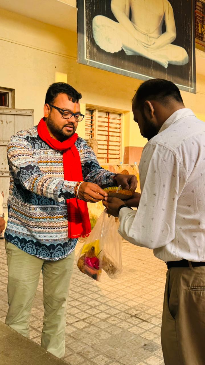 Offering prasad to a young devotee